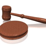 Wooden gavel from the court on white background